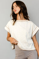 Cream open-back crop top brown reverse stitching