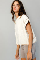 Cream open-back crop top brown reverse stitching
