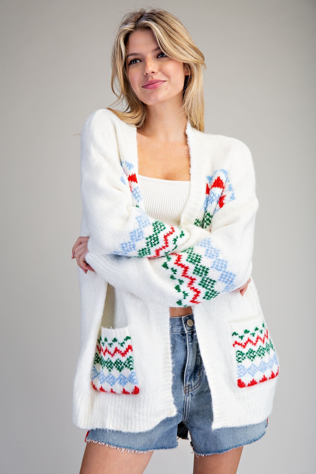 White sweater with Christmas Colored patterned designs Cardigan Sweater