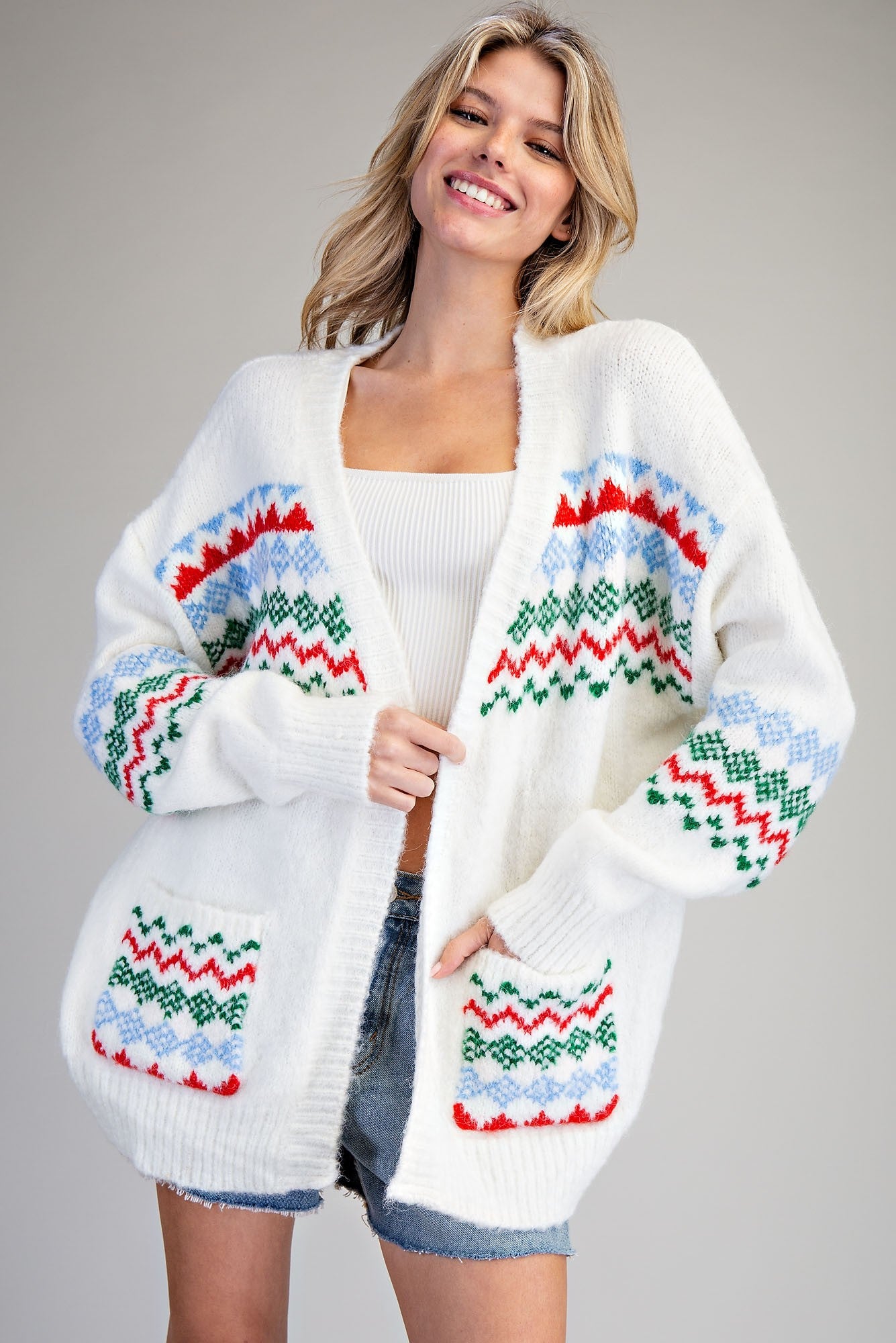 White sweater with Christmas Colored patterned designs Cardigan Sweater