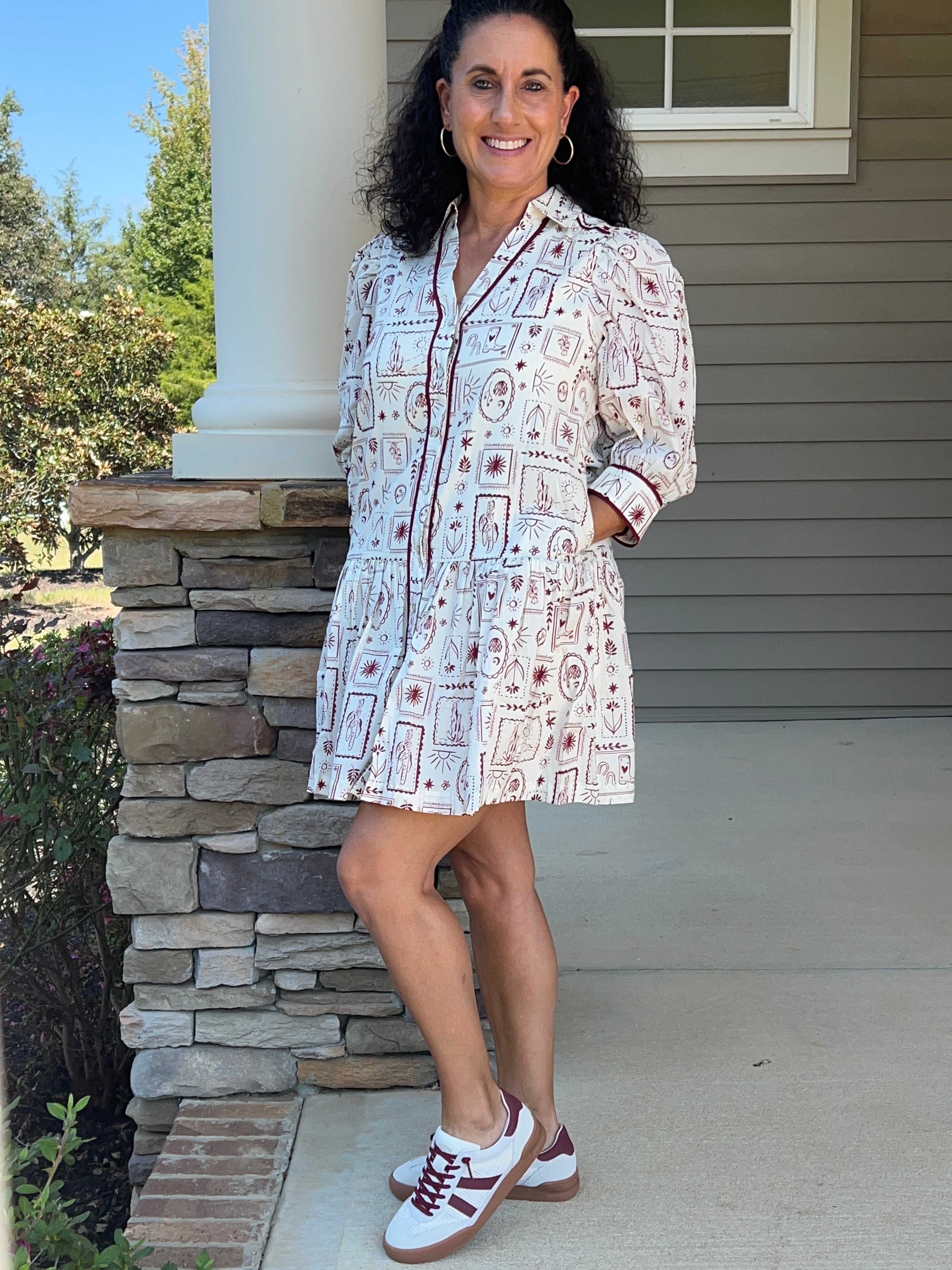white v-neck dress with garnet colored western designs