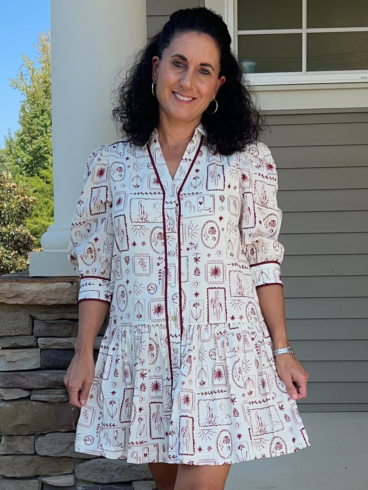 white v-neck dress with garnet colored western designs