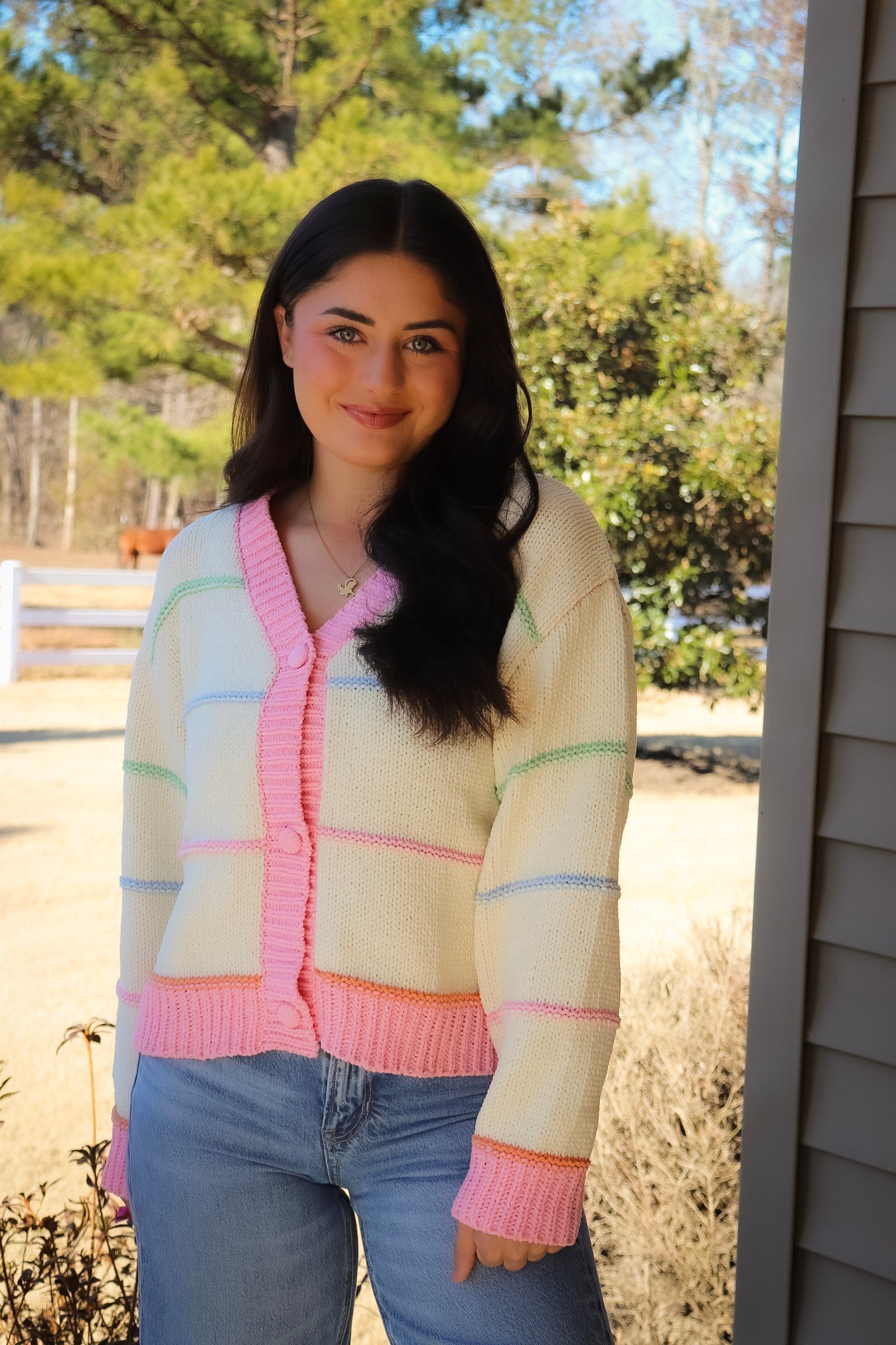 Striped Button Down cream Cardigan with pink trim and pink, blue, green & orange stripes