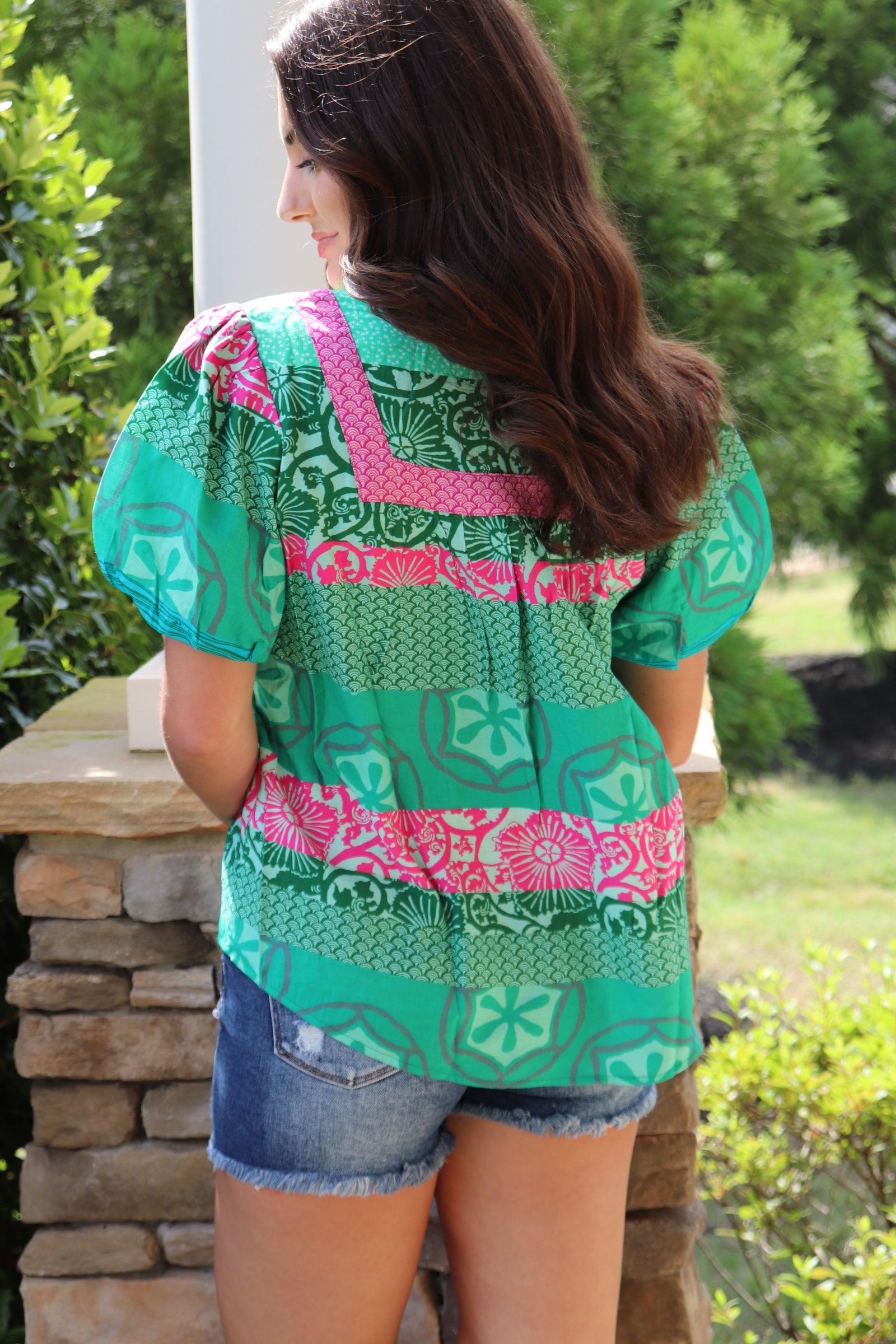 green and pink detailed design short sleeve blouse with pink front ties. Loose fit and puff sleeves
