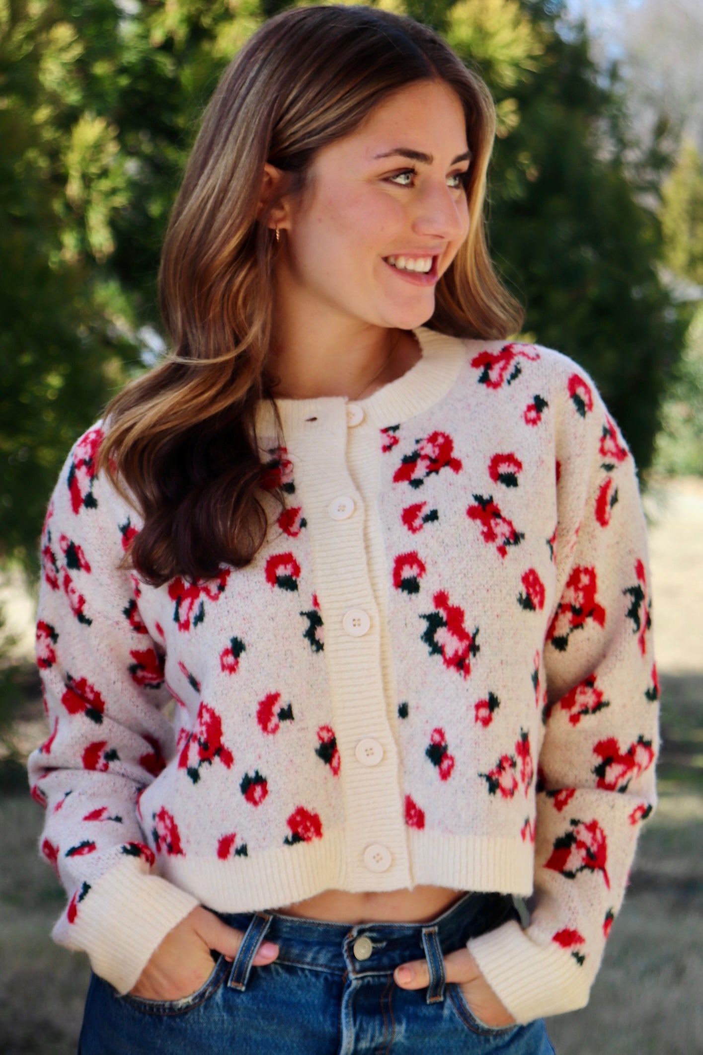 Cream cardigan with red & navy flowers features a delicate floral pattern