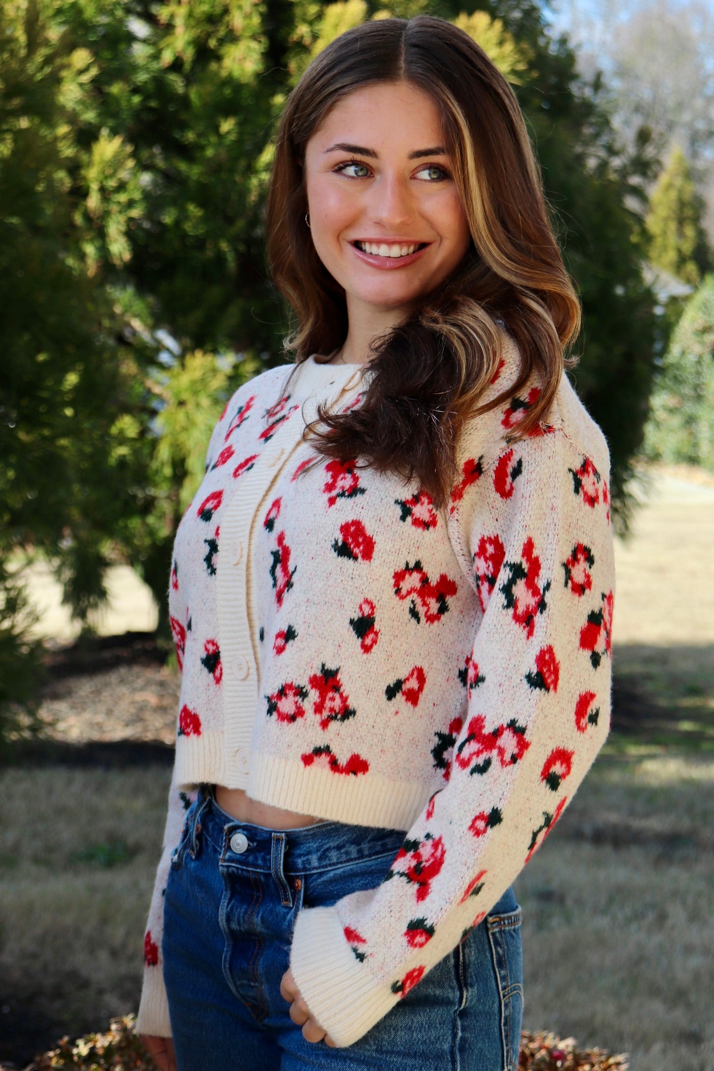 Cream cardigan with red & navy flowers features a delicate floral pattern