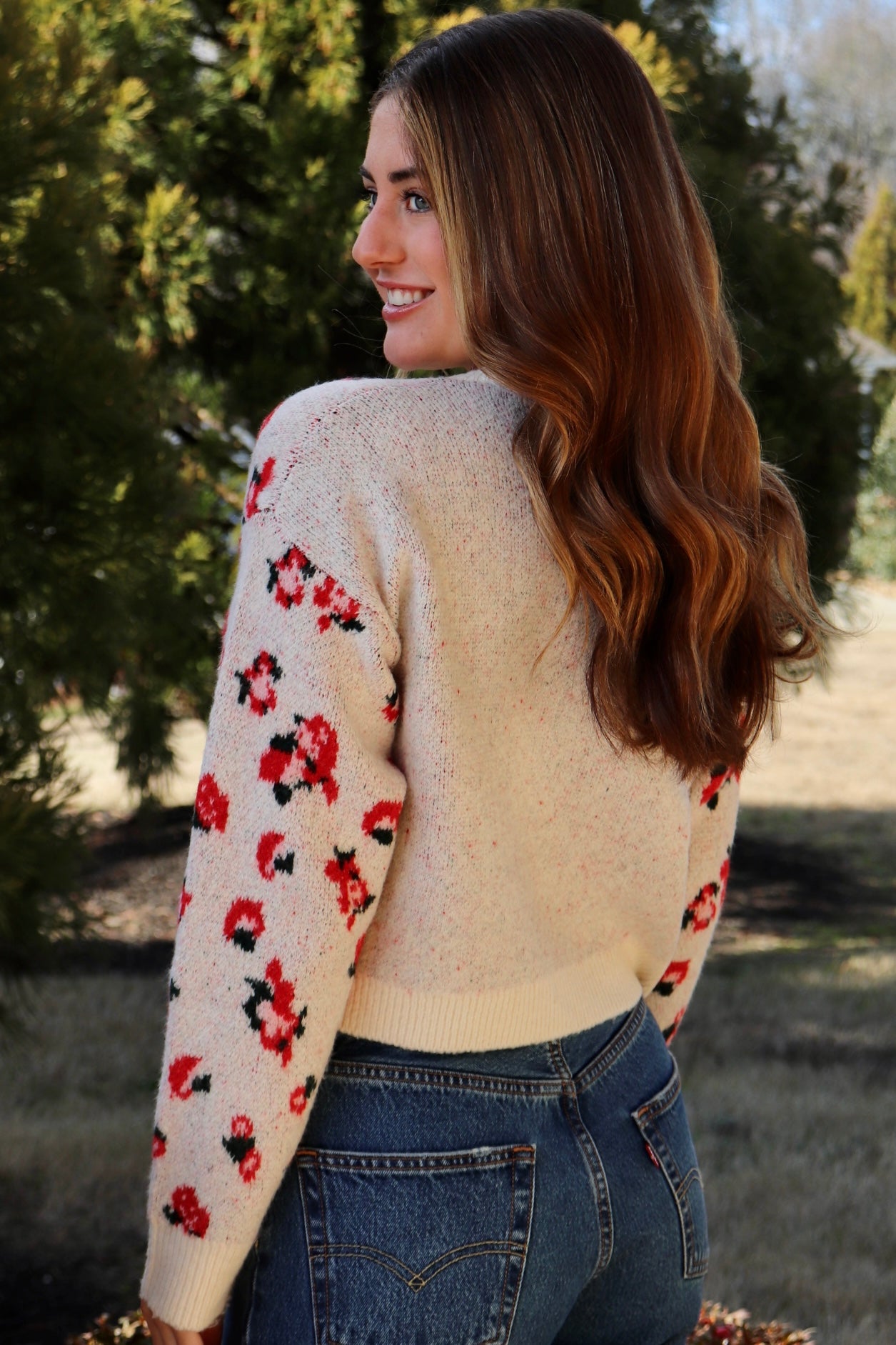 Cream cardigan with red & navy flowers features a delicate floral pattern
