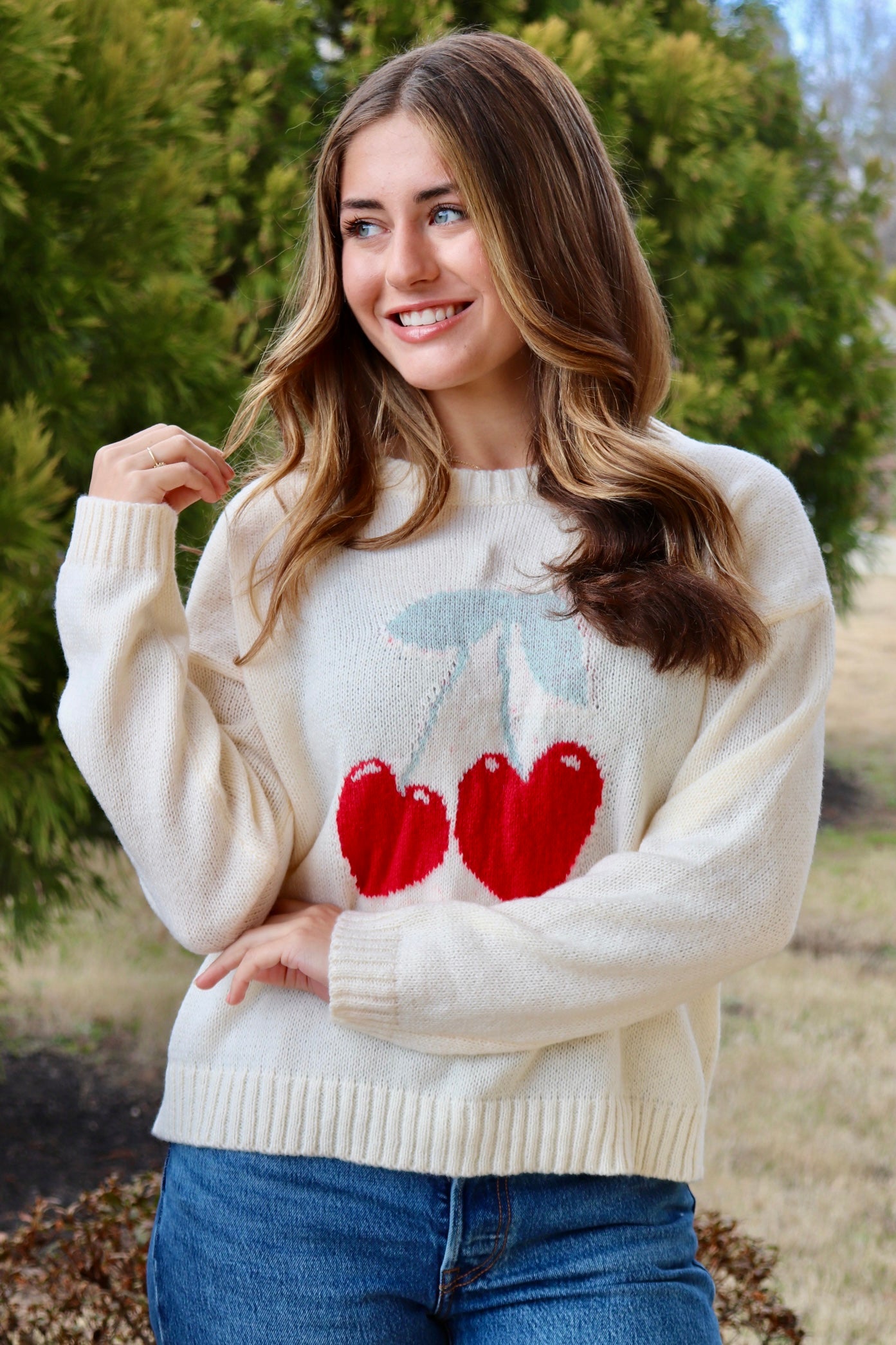 Cream long sleeve sweater with heart shaped red cherries