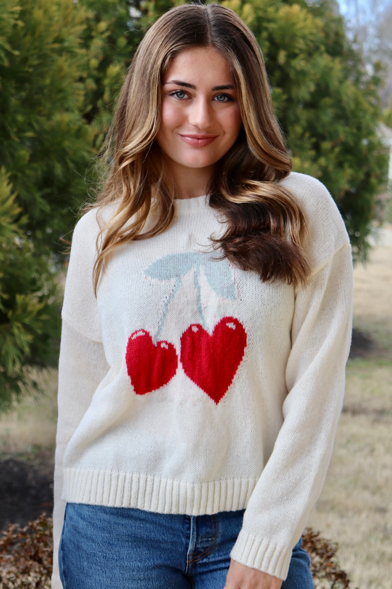 Cream long sleeve sweater with heart shaped red cherries