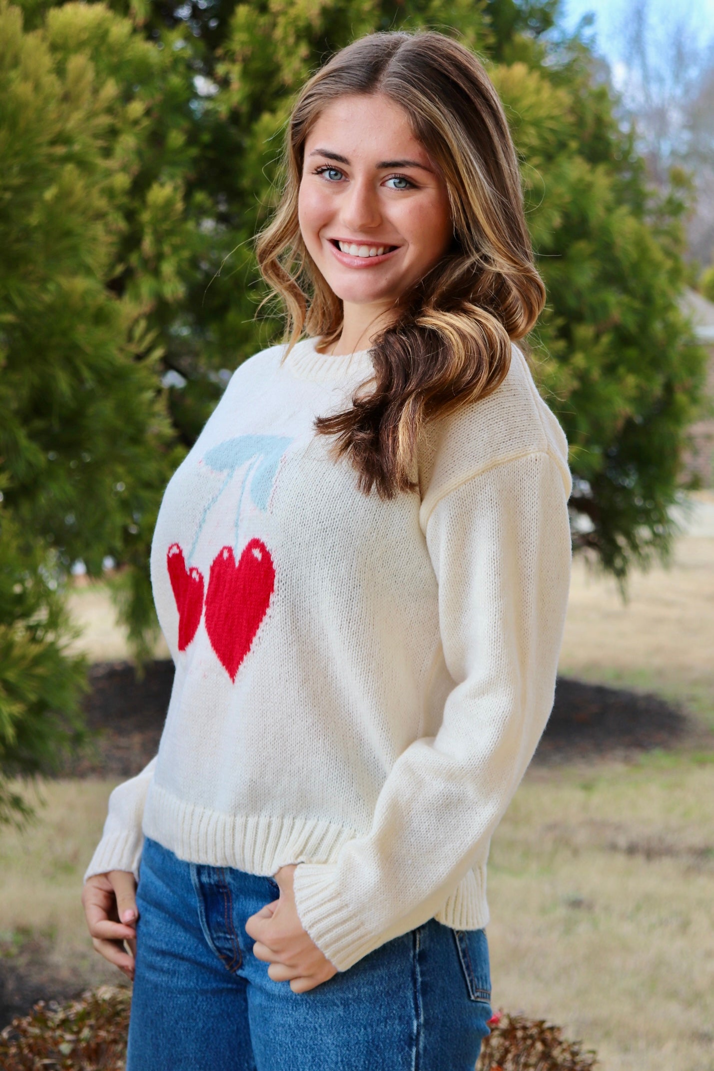 Cream long sleeve sweater with heart shaped red cherries