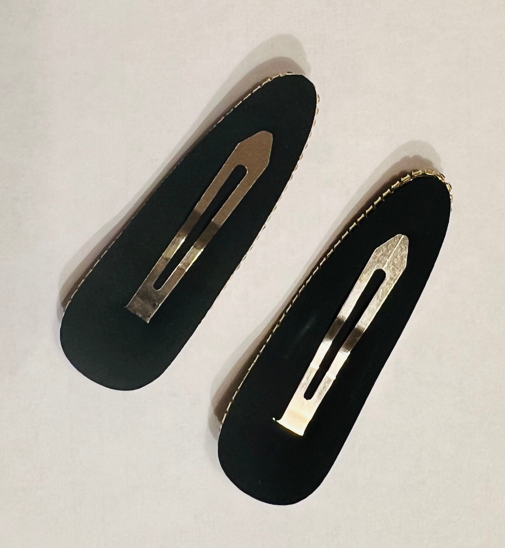 brown checkered hair clip and gray checkered hair clip