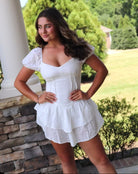 short white eyelet dress sweetheart neckline. ruffled hem.