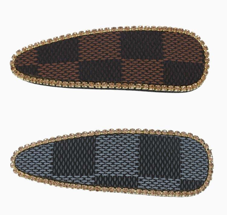 back of brown checkered hair clip and gray checkered hair clip
