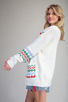 White sweater with Christmas Colored patterned designs Cardigan Sweater