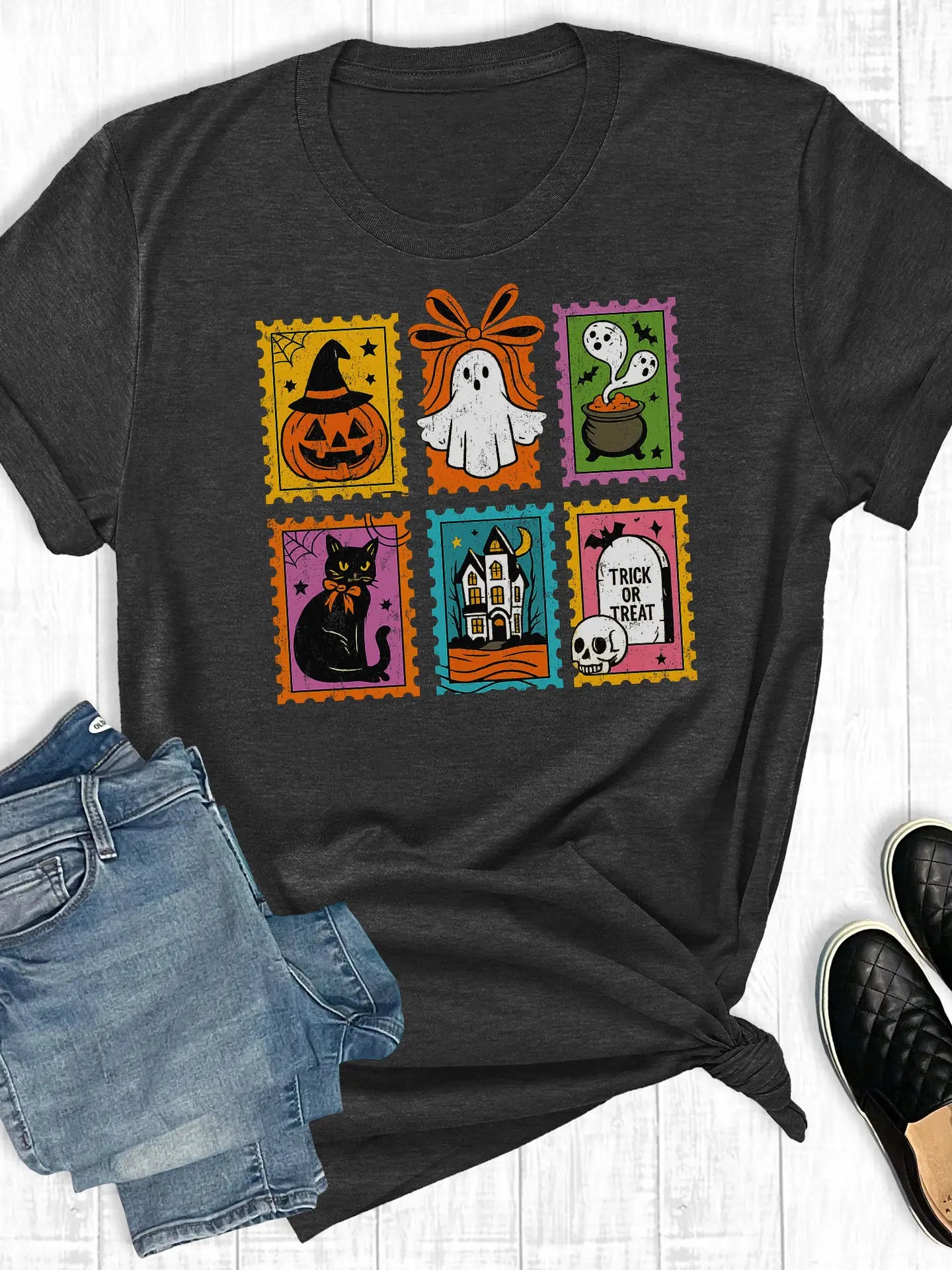 Black t-shirt with Halloween-themed design on a white background