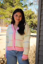 Load image into Gallery viewer, Striped Button Down cream Cardigan with pink trim and pink, blue, green &amp; orange stripes
