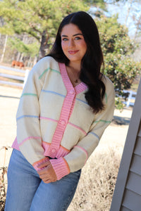 Striped Button Down cream Cardigan with pink trim and pink, blue, green & orange stripes