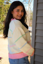 Load image into Gallery viewer, Striped Button Down cream Cardigan with pink trim and pink, blue, green &amp; orange stripes
