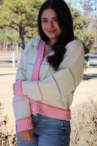 Striped Button Down cream Cardigan with pink trim and pink, blue, green & orange stripes