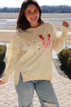 Load image into Gallery viewer, Cream colored sweatshirt with multi-colored LOVE quilted patchwork
