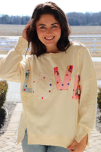 Load image into Gallery viewer, Cream colored sweatshirt with multi-colored LOVE quilted patchwork
