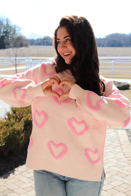 Light pink sweater with bright pink puffy hearts