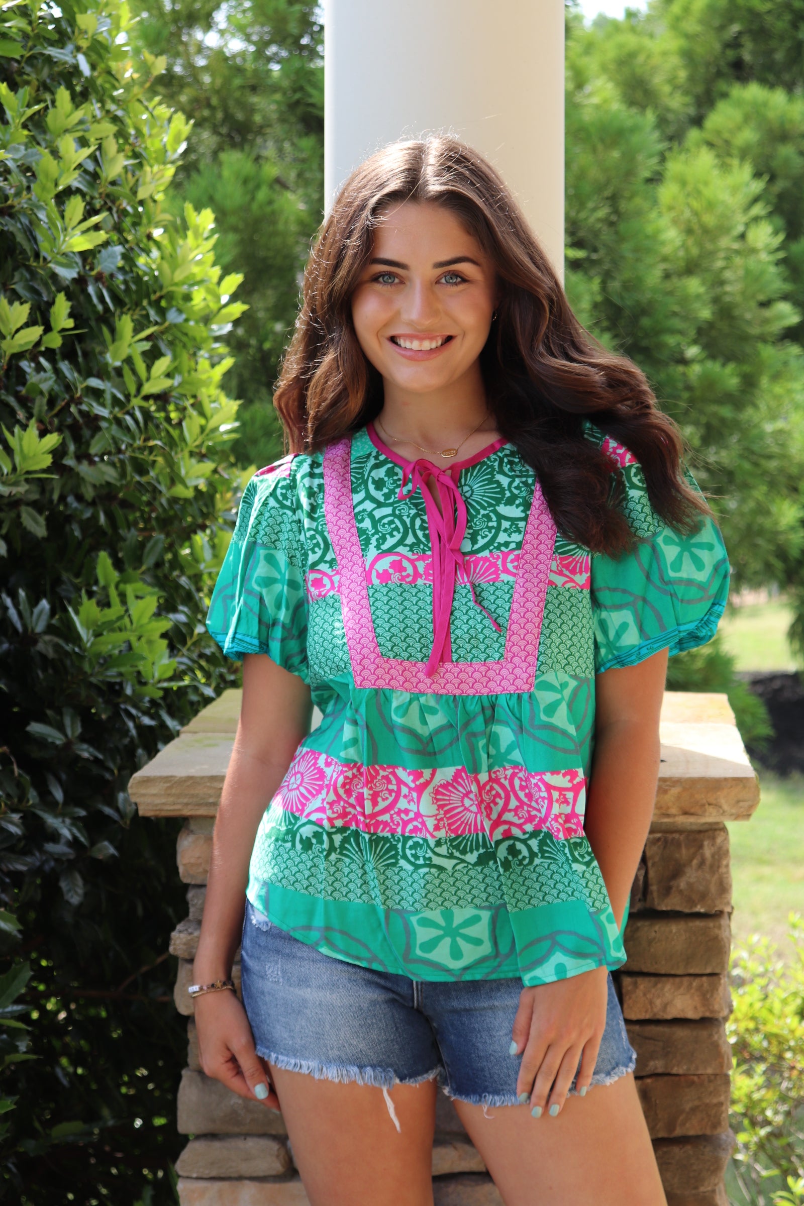 green and pink detailed design short sleeve blouse with pink front ties.  Loose fit and puff sleeves