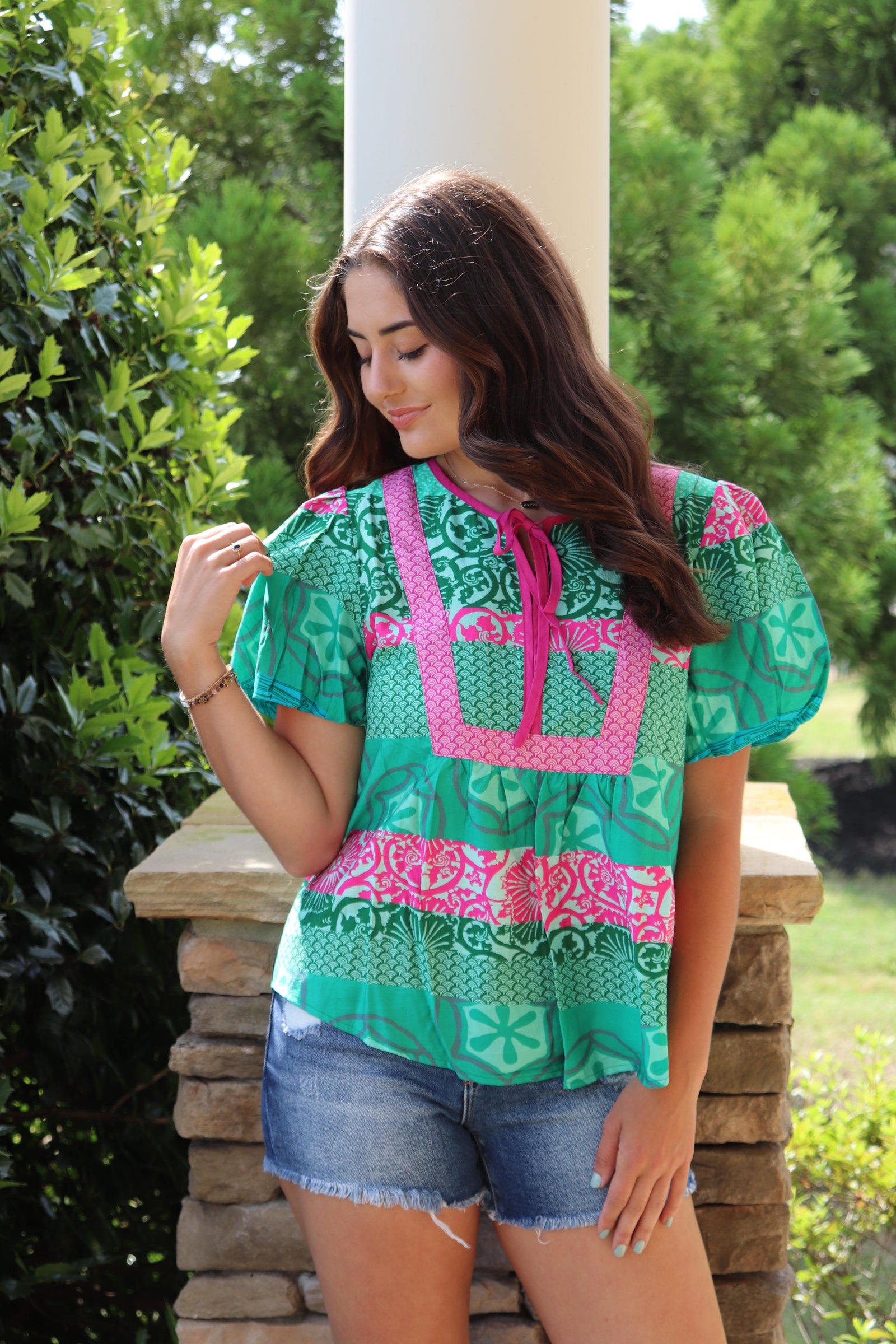 green and pink detailed design short sleeve blouse with pink front ties.  Loose fit and puff sleeves