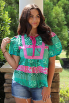 green and pink detailed design short sleeve blouse with pink front ties.  Loose fit and puff sleeves