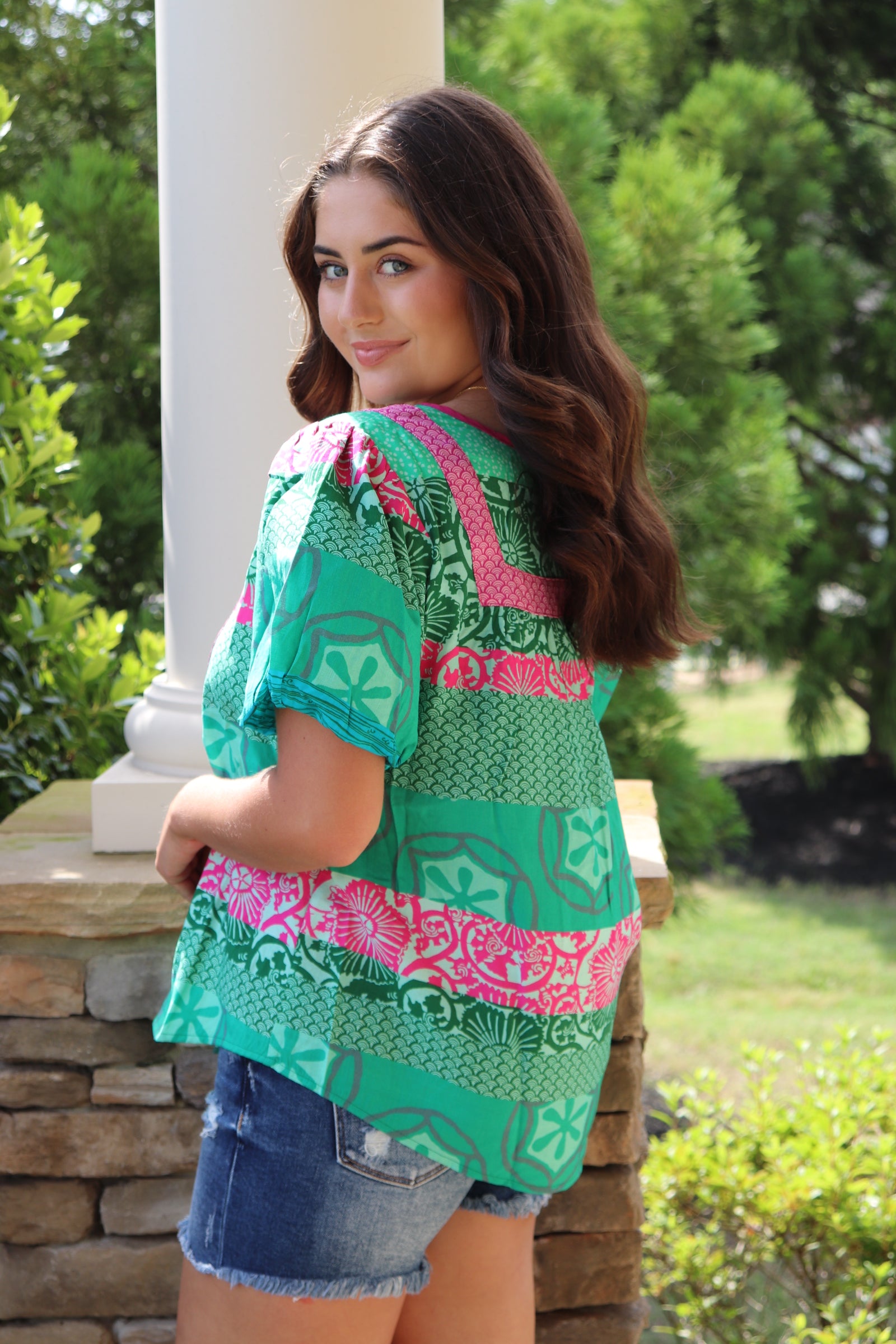 green and pink detailed design short sleeve blouse with pink front ties.  Loose fit and puff sleeves