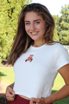 White baby tee with red football bear embroidery design