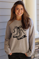Gray sweater with black ice skate design