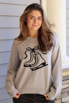 Gray sweater with black ice skate design