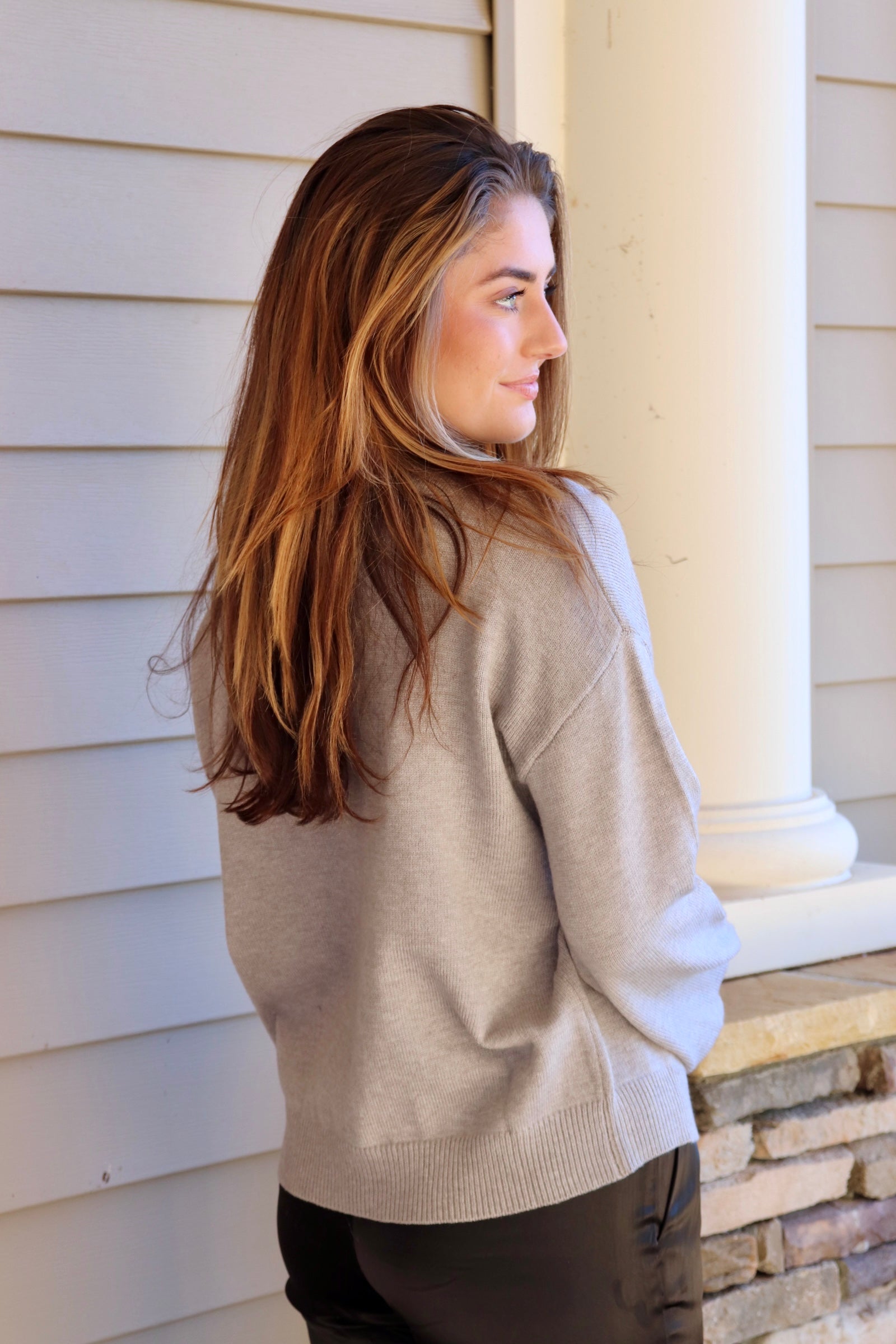 Gray sweater with black ice skate design