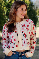 Cream cardigan with red & navy flowers features a delicate floral pattern