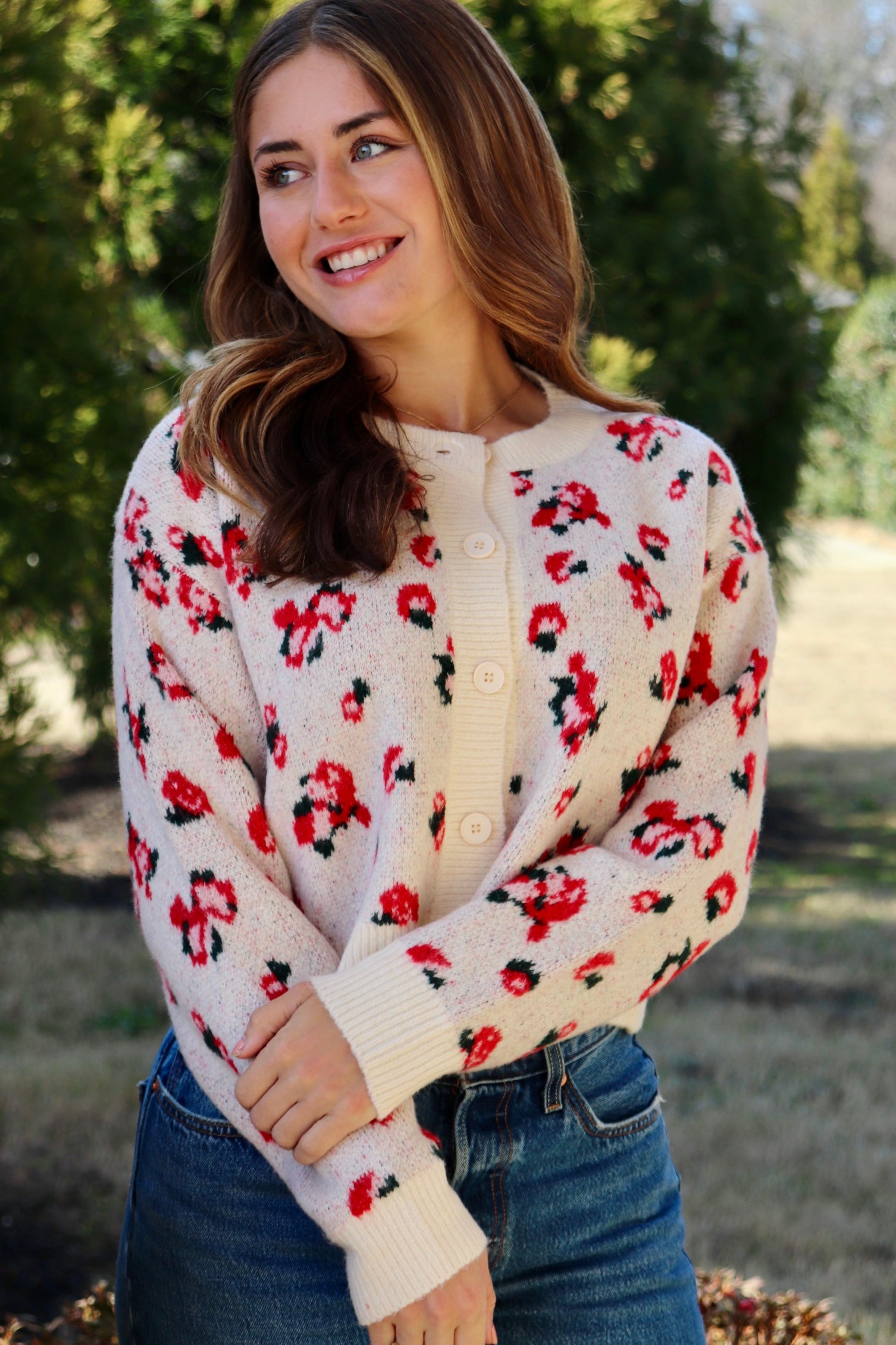 Cream cardigan with red & navy flowers features a delicate floral pattern