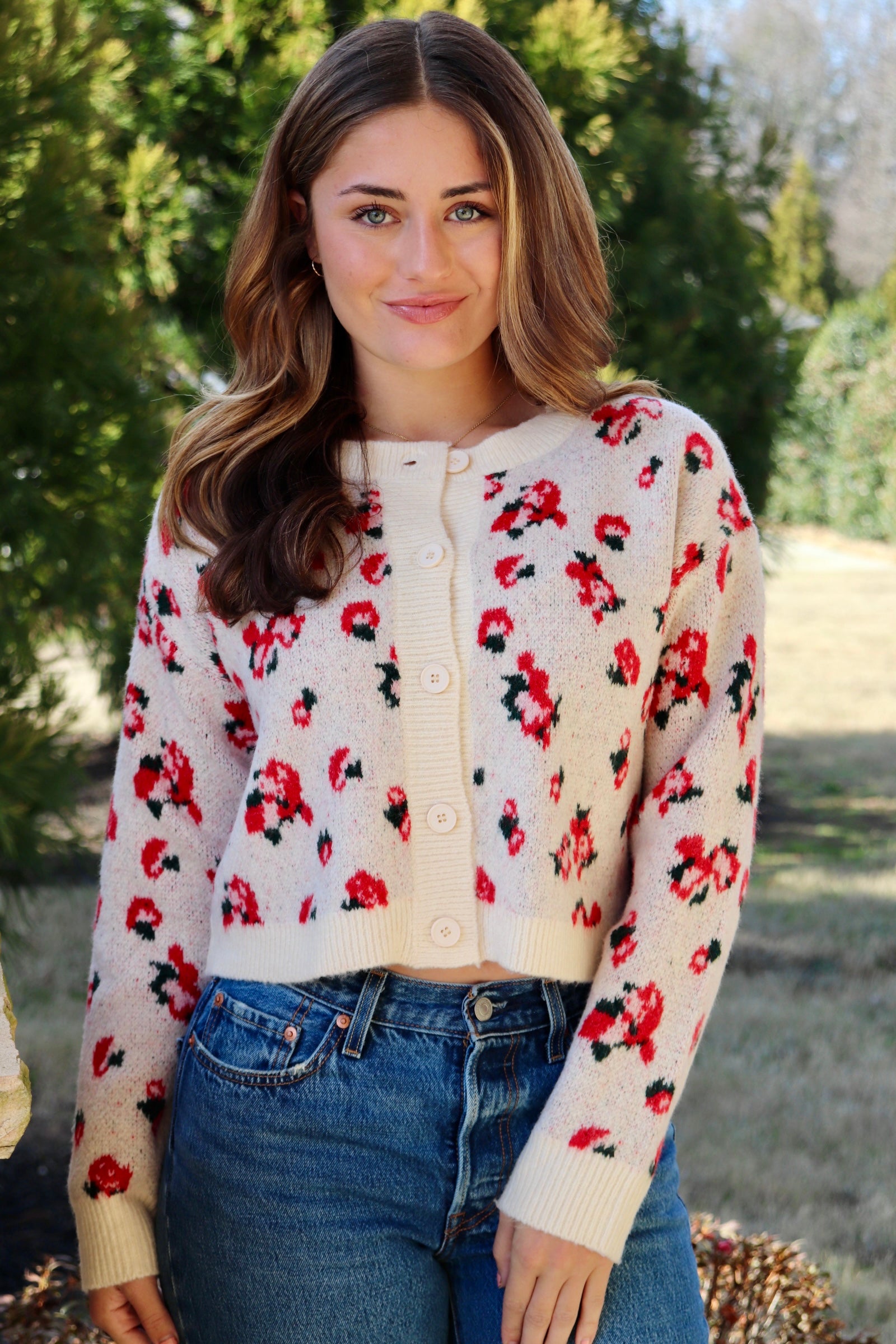 Cream cardigan with red & navy flowers features a delicate floral pattern