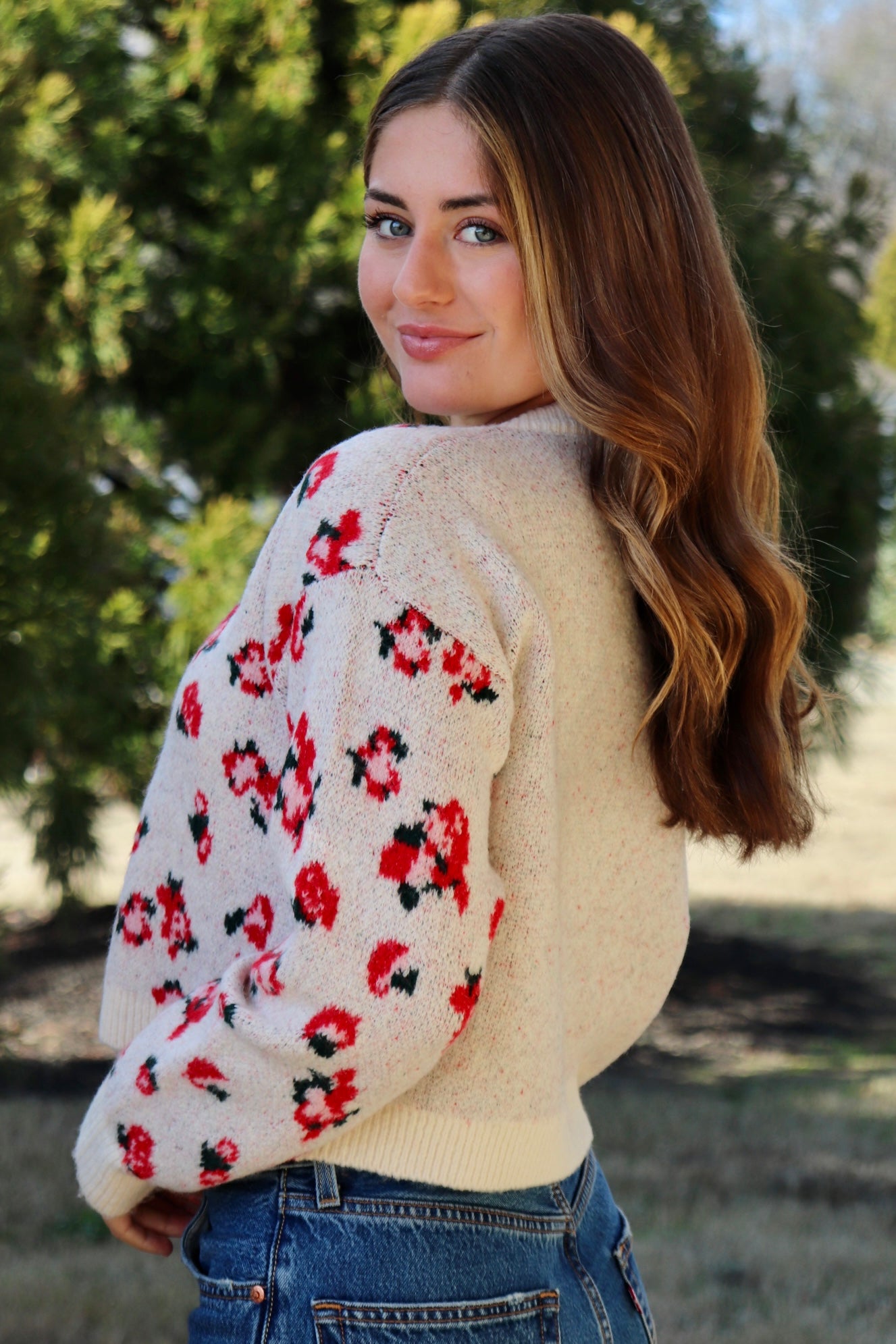 Cream cardigan with red & navy flowers features a delicate floral pattern