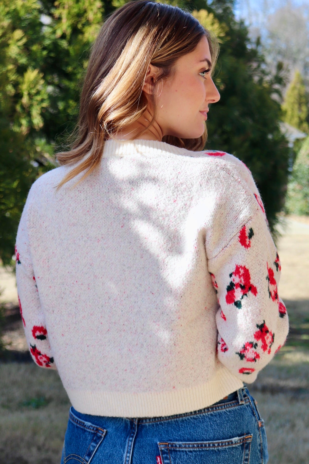 Cream cardigan with red & navy flowers features a delicate floral pattern