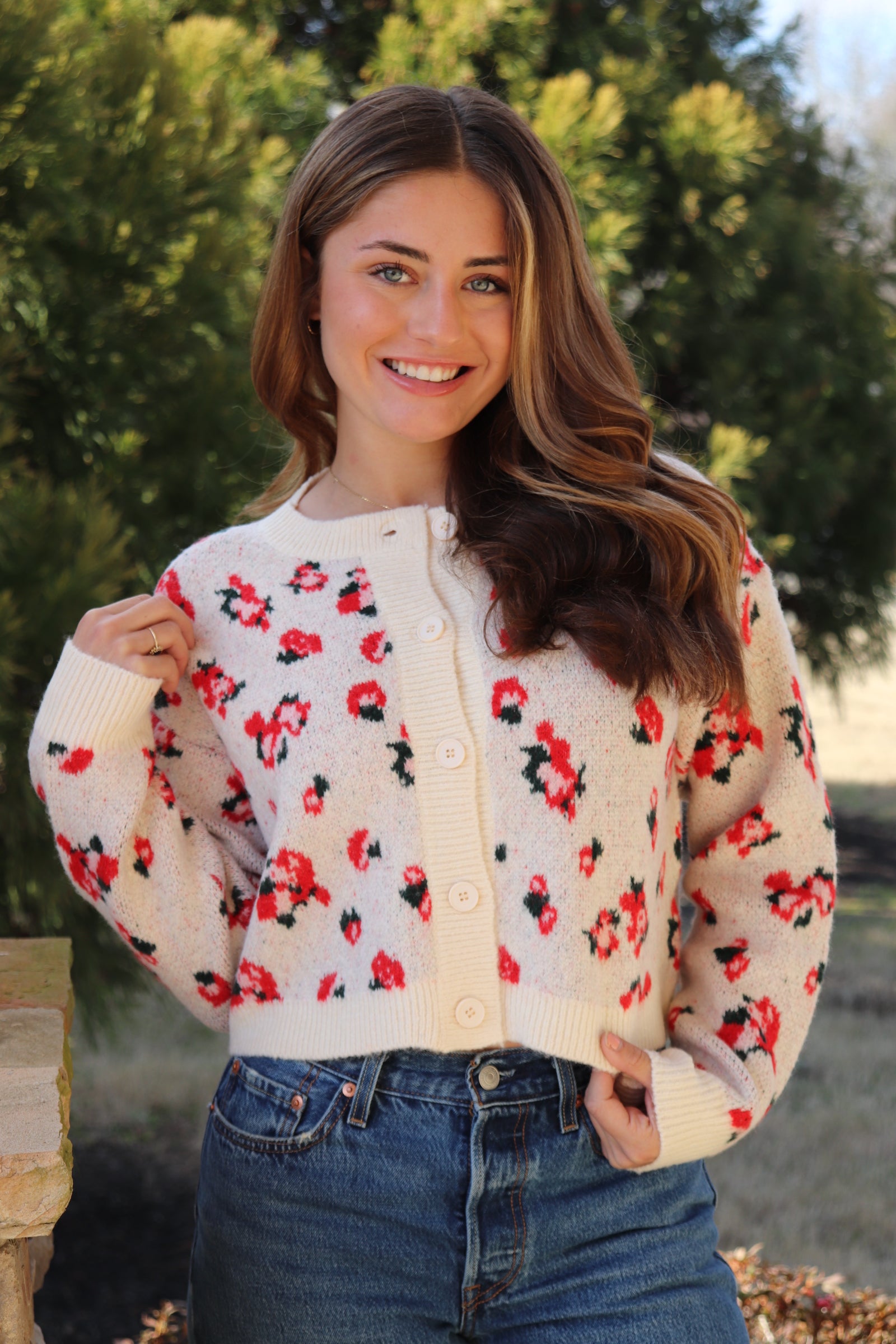 Cream cardigan with red & navy flowers features a delicate floral pattern
