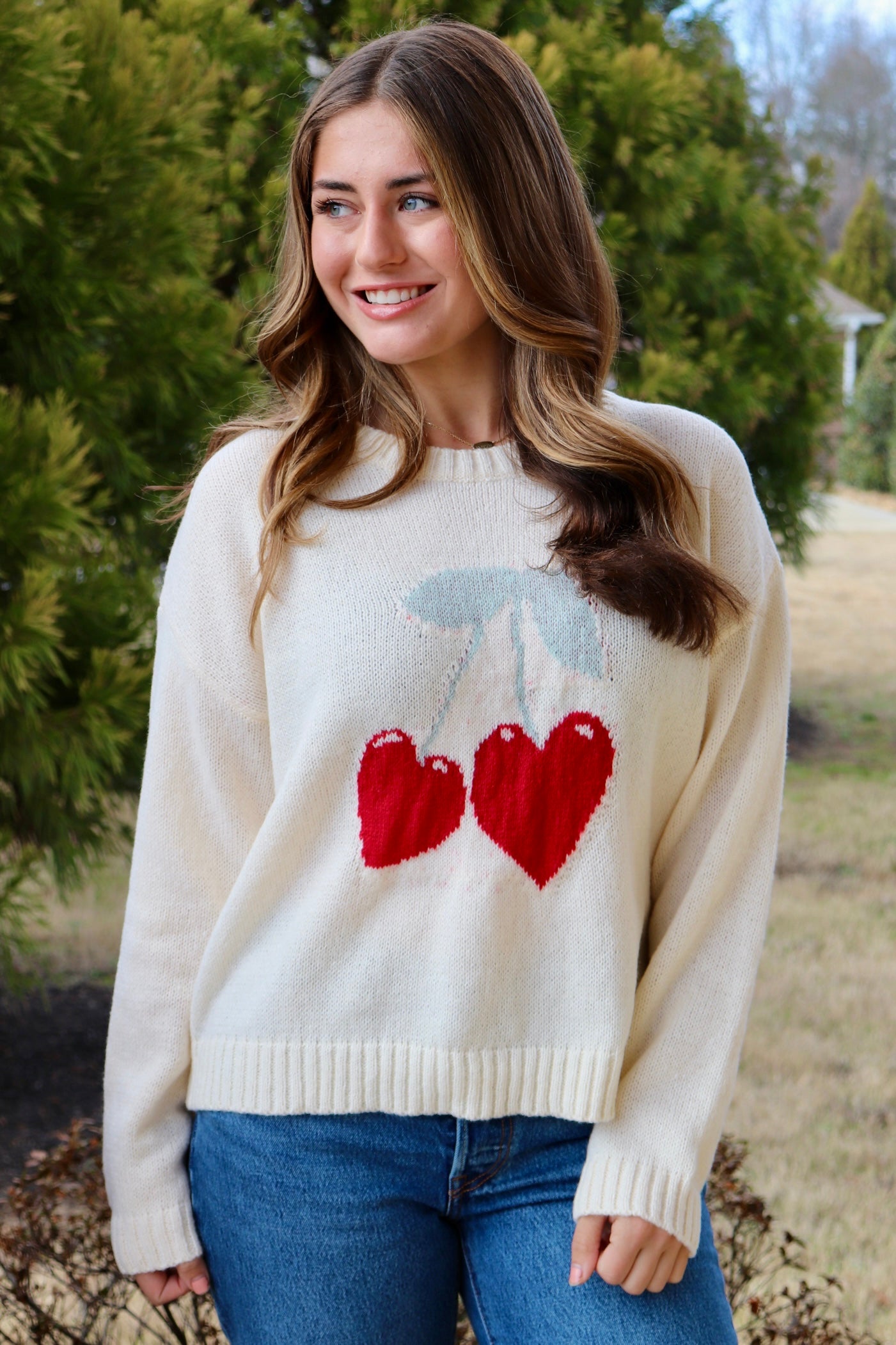 Cream long sleeve sweater with heart shaped red cherries