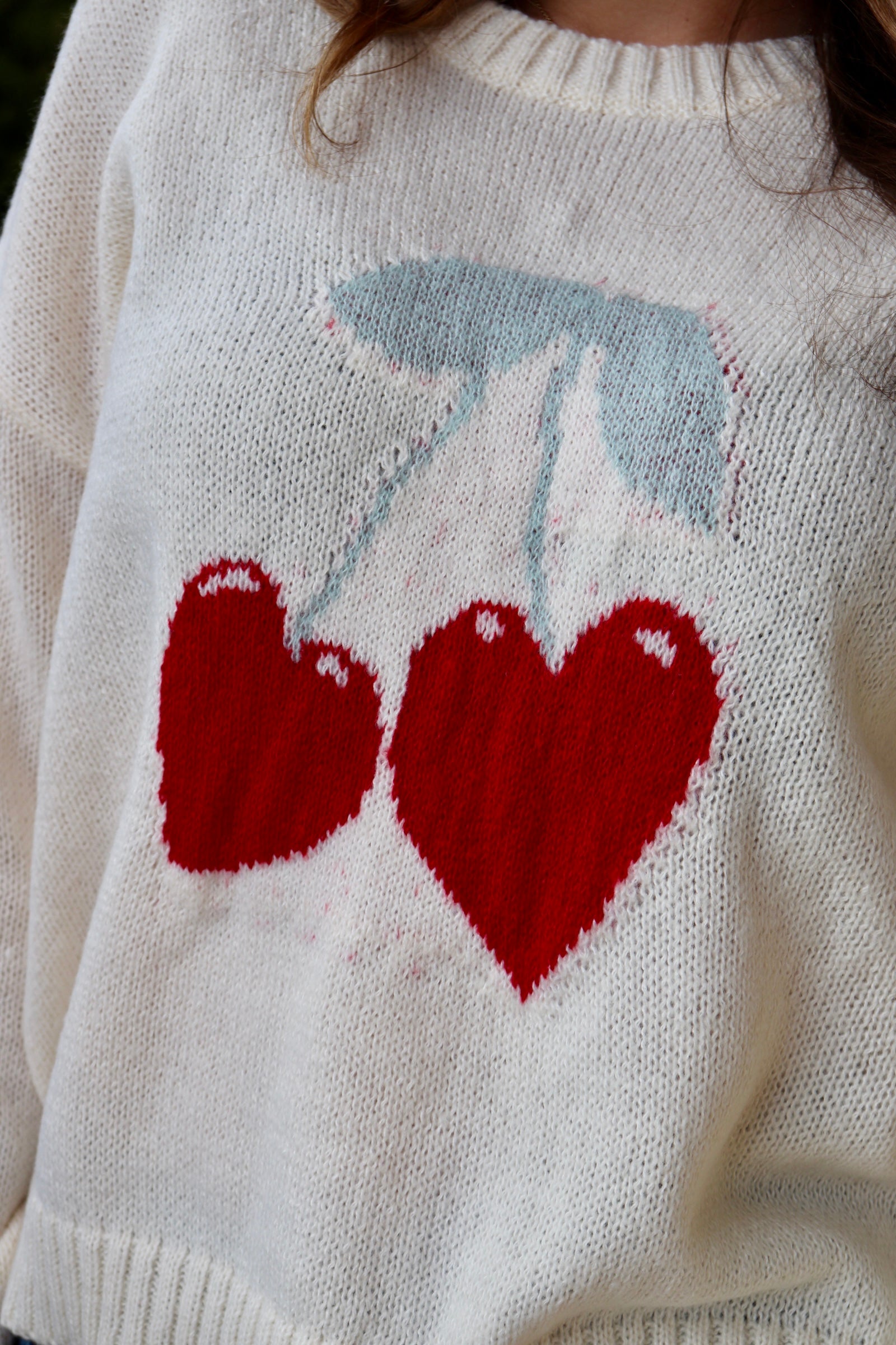 Cream long sleeve sweater with heart shaped red cherries