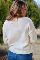 Back of the Cream long sleeve sweater with heart shaped red cherries