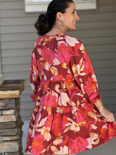 Load image into Gallery viewer, pinks, reds, and orange florals are artfully combined in a flowy, 3/4 sleeve tiered mini dress. 
