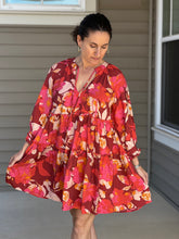 Load image into Gallery viewer,  pinks, reds, and orange florals are artfully combined in a flowy, 3/4 sleeve tiered mini dress. 
