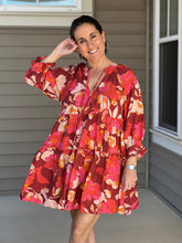 Load image into Gallery viewer, pinks, reds, and orange florals are artfully combined in a flowy, 3/4 sleeve tiered mini dress. 
