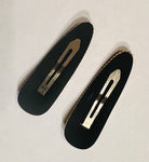 brown checkered hair clip and gray checkered hair clip