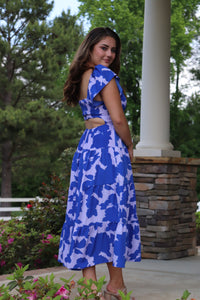 shades of blue floral midi dress. open back. elastic waist. flutter sleeves