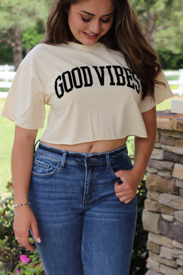 cream colored cropped tee with GOOD VIBES velvet writing