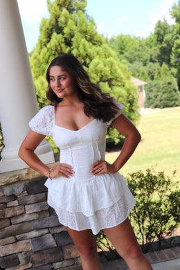 short white eyelet dress sweetheart neckline. ruffled hem.